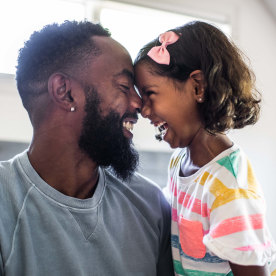 father and daughter laughing 